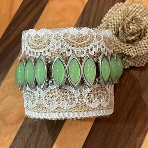 Silver and green gem elastic bracelet.